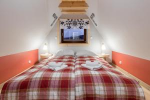 Posteľ alebo postele v izbe v ubytovaní Apartamenty Rockus LUX & SPA Zakopane