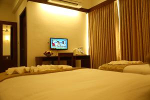 Postel nebo postele na pokoji v ubytování Niko Hotels