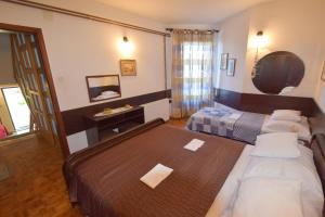 Postel nebo postele na pokoji v ubytování Apartment Petrlin