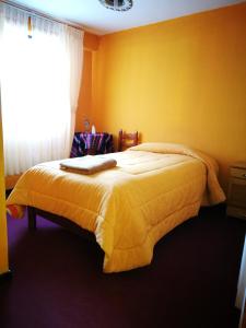 Postel nebo postele na pokoji v ubytování Hotel Utama