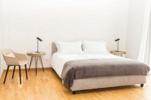A bed or beds in a room at 200 ROOMS & TERRACE