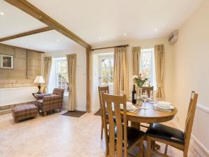 a dining room with a table and chairs at George III in Winchcombe