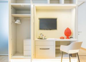 A television and/or entertainment centre at 200 ROOMS & TERRACE