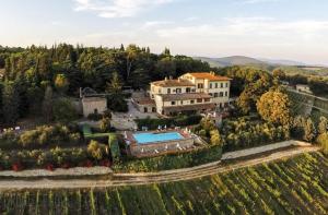 an aerial view of a house in a vineyard at Hotel Villa Casalecchi in Castellina in Chianti
