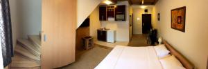 Ένα ή περισσότερα κρεβάτια σε δωμάτιο στο Hotel Topcider