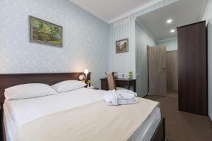 Postel nebo postele na pokoji v ubytování West Park Hotel