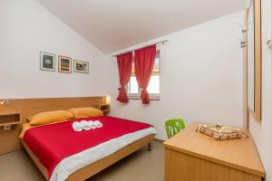 Ένα ή περισσότερα κρεβάτια σε δωμάτιο στο Apartments Mirica