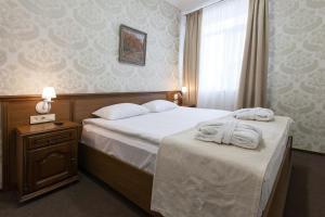 Postel nebo postele na pokoji v ubytování West Park Hotel