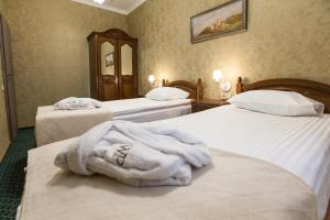 Postel nebo postele na pokoji v ubytování West Park Hotel