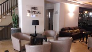 a lobby with chairs and a couch and a table at Tropicana Hotel in St Julian's