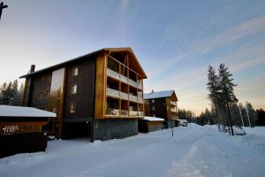 Levillas Tunturinlaita Apartments v zimě