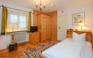Postel nebo postele na pokoji v ubytování Stoll's Hotel Alpina