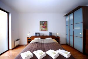 Postel nebo postele na pokoji v ubytování Ski & Sun Wellness Apartments