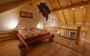 Postel nebo postele na pokoji v ubytování Holzhaus Lugerhof