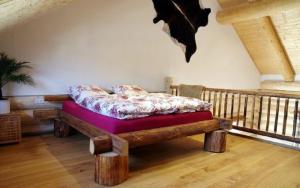 Postel nebo postele na pokoji v ubytování Holzhaus Lugerhof