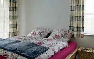 Postel nebo postele na pokoji v ubytování Holzhaus Lugerhof