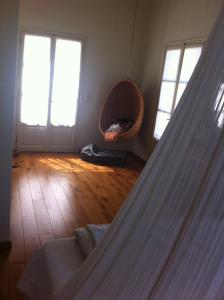 a room with a hammock in a room with windows at Xenon Estate in Spetses