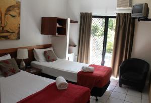 Ein Bett oder Betten in einem Zimmer der Unterkunft Bohemia Resort Cairns
