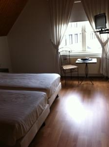 Een bed of bedden in een kamer bij Hotel-Restaurant Krabbendam