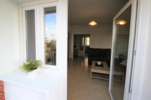 a view of a living room with a sliding glass door at CasaTuris Playa Postiguet A113 in Alicante