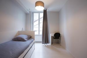 Katil atau katil-katil dalam bilik di Apart By Jo