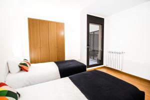 Postel nebo postele na pokoji v ubytování Font del Ferro Apartments