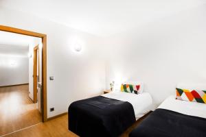 Postel nebo postele na pokoji v ubytování Font del Ferro Apartments