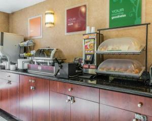 a fast food kitchen with a counter with some food at Red Lion Inn & Suites Long Island City in Queens