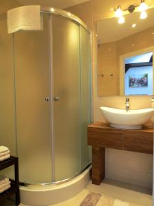a bathroom with a shower and a sink at Apartament krakowski GIMO na Kazimierzu in Krakow +26 photos