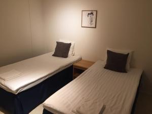 Mänty Holiday Apartments tesisinde bir odada yatak veya yataklar