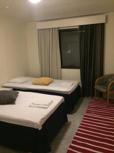 Mänty Holiday Apartments tesisinde bir odada yatak veya yataklar