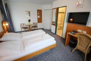 Postel nebo postele na pokoji v ubytování Hotel Relax