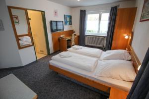 Postel nebo postele na pokoji v ubytování Hotel Relax