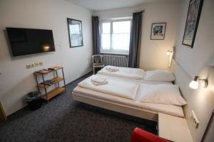 Postel nebo postele na pokoji v ubytování Hotel Relax