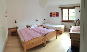 Ein Bett oder Betten in einem Zimmer der Unterkunft Die Bergperlen Dependance