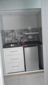 a kitchen with a sink and a counter top at @Home Cottage in Johannesburg +12 photos