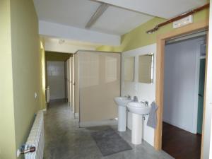 a bathroom with a sink and a toilet at Albergue de peregrinos El Convento in Santillana del Mar