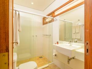 a bathroom with a sink and a toilet and a shower at Kalango Hotel Boutique in Ilhabela