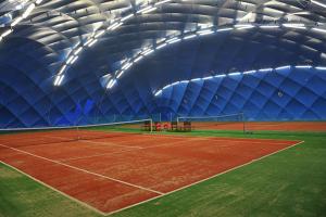 a tennis court in a domed building at Penzion TCV Pardubice in Pardubice