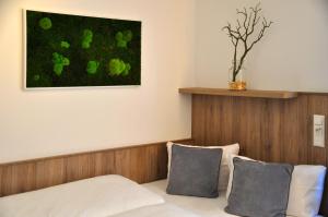 Postel nebo postele na pokoji v ubytování Hotel Perlach Allee by Blattl