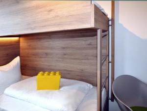 Postel nebo postele na pokoji v ubytování Hotel Perlach Allee by Blattl