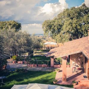 a view of a garden with a pavilion at Agriturismo Cantagalli in San Quirico dʼOrcia