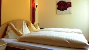 Cama ou camas em um quarto em Hotel Restaurant JUWEL