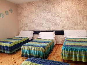 Postel nebo postele na pokoji v ubytování Hostal Padre Isla 1