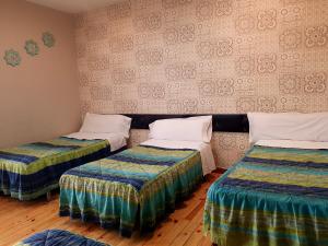 Posteľ alebo postele v izbe v ubytovaní Hostal Padre Isla 1
