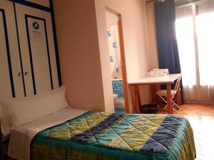 Posteľ alebo postele v izbe v ubytovaní Hostal Padre Isla 1