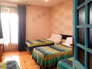 Posteľ alebo postele v izbe v ubytovaní Hostal Padre Isla 1