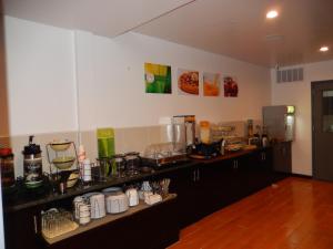 a kitchen with a counter with many items on it at Quality Inn near Sunset Park in Brooklyn