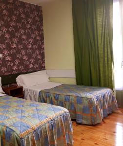 Posteľ alebo postele v izbe v ubytovaní Hostal Padre Isla 1