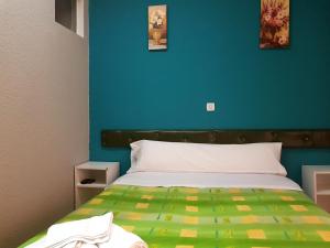 Posteľ alebo postele v izbe v ubytovaní Hostal Padre Isla 1